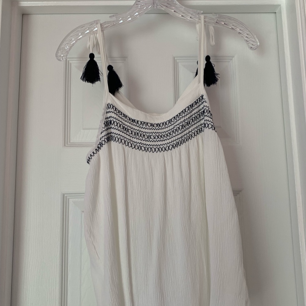 Flowy white tank top with navy blue detailing